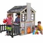 Casuta de joaca Cuptorul cu Lemne Kidkraft Cozy Hearth - Casa cu LEDuri pentru copii cu pridvor si bancute cu bucatarie si accesorii Cabin PlayHouse